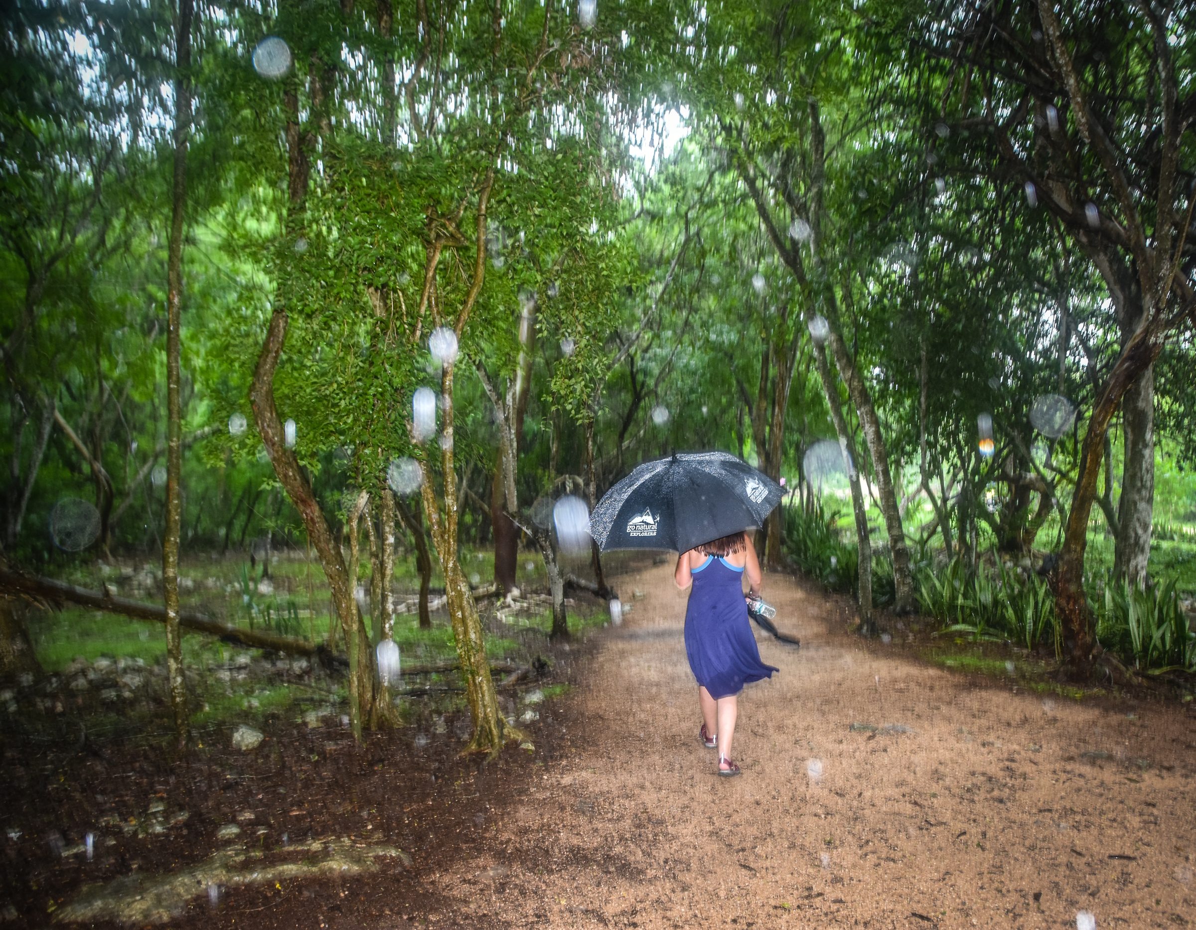 Woman walking in rain